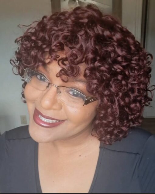 CEO wearing glueless burgundy curly wig