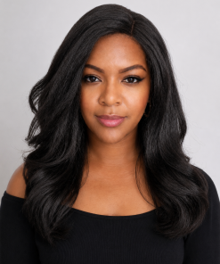 Black woman wearing a synthetic kinky straight glueless wig with soft natural texture and Swiss lace front against a clean studio background.